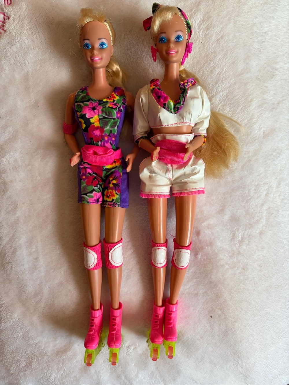 Barbie Dolls in Floral Purple and Cream Outfits with Hot Pink Skates
